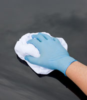 Car being polished by hand as part of car & truck cleaning