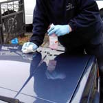 Car being polished by hand as shown in the Valet Guide