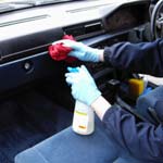 Car's interior being dressed by hand as part of the Valet Guide